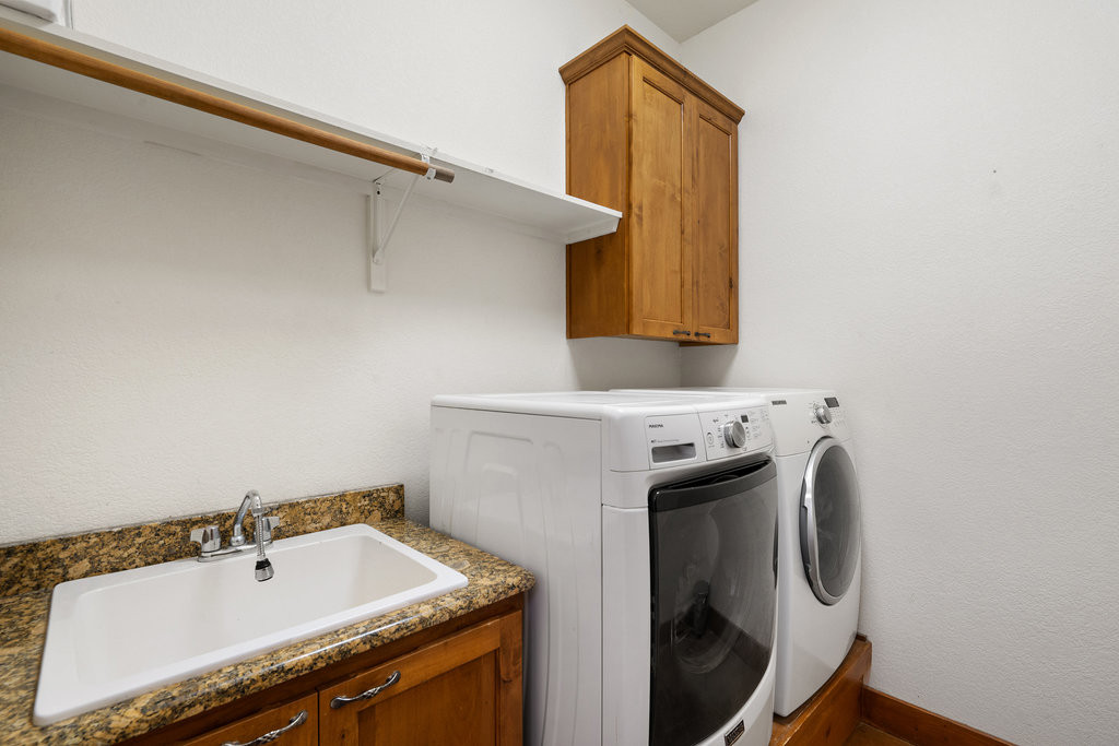 267 Corral Road Smithville, TX 78957 - Photo 36 of 40 a utility room with a sink dryer and washer