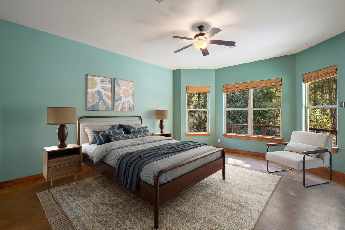 267 Corral Road Smithville, TX 78957 - Photo 5 of 40 a bedroom with a bed and a chandelier