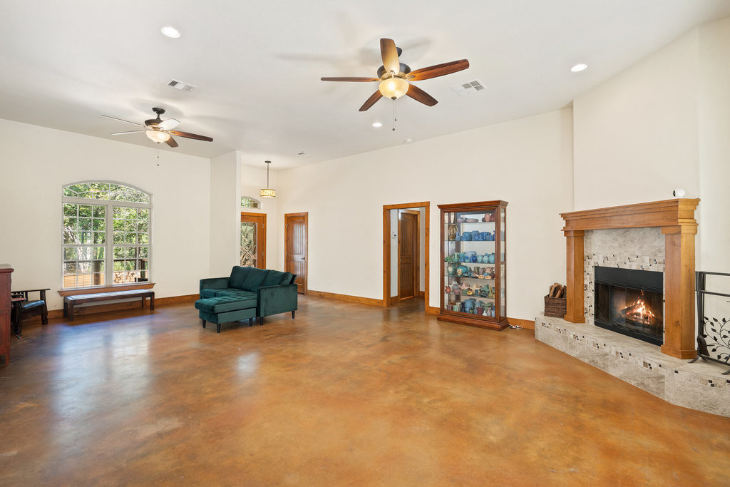 267 Corral Road Smithville, TX 78957 - Photo 10 of 40 a living room with furniture and a fireplace