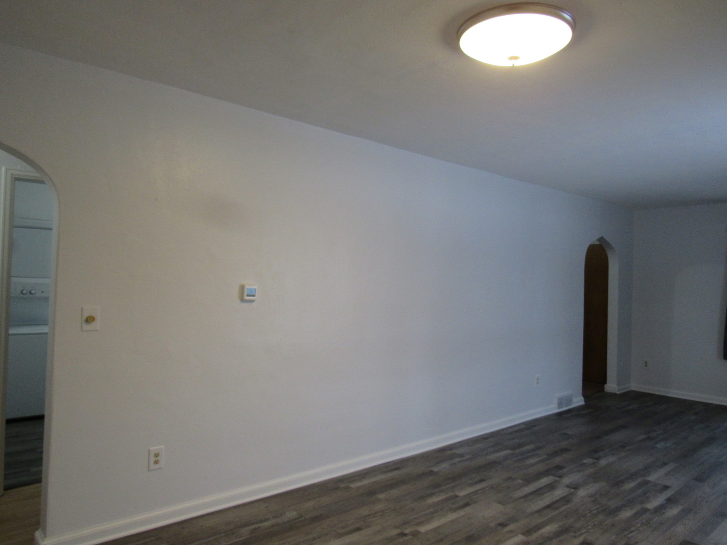 730 Lincoln Road Bettendorf, IA 52722 - Photo 3 of 13 an empty room with wooden floor