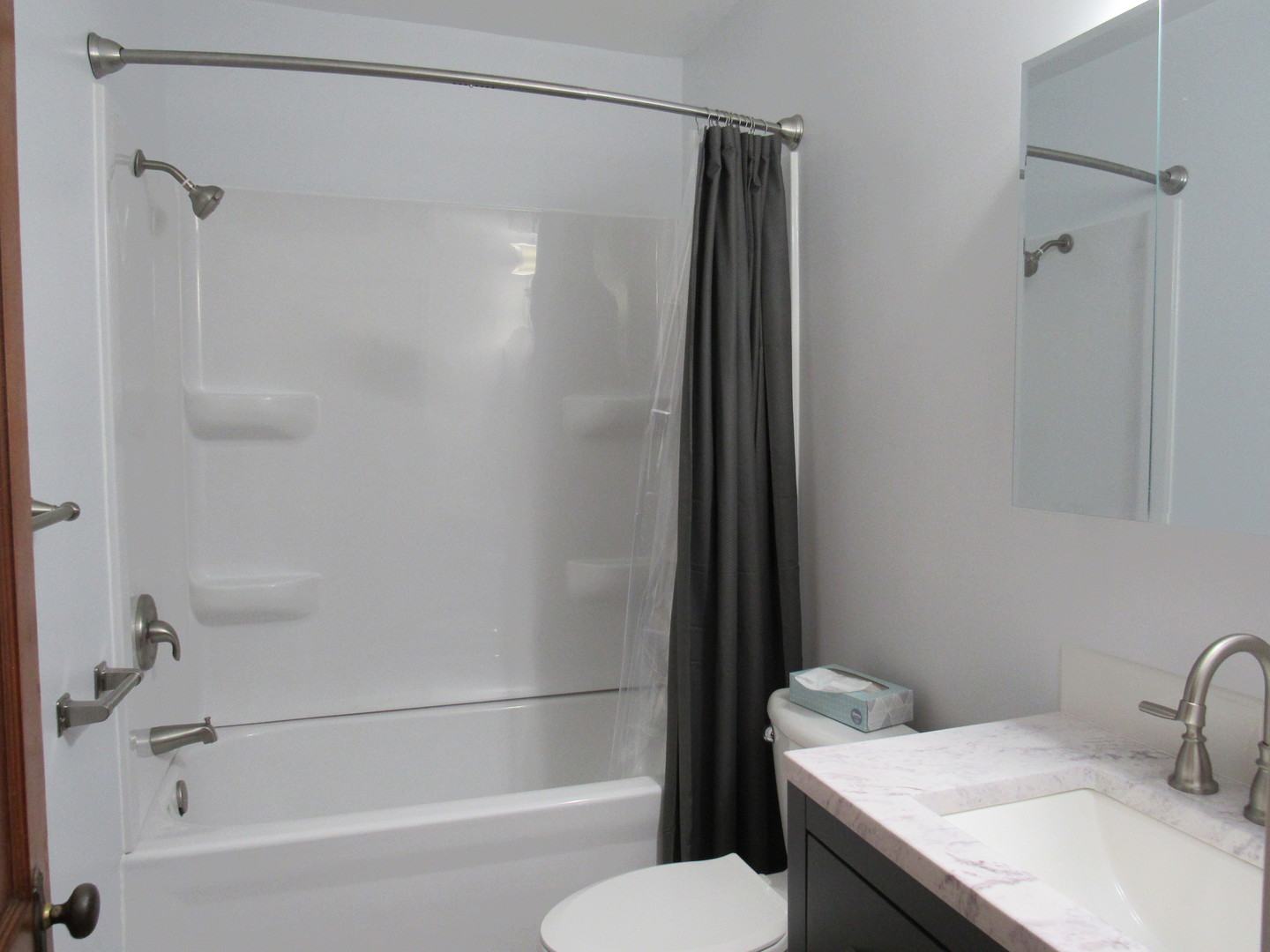 730 Lincoln Road Bettendorf, IA 52722 - Photo 6 of 13 a bathroom with a granite countertop bathtub shower sink vanity and toilet