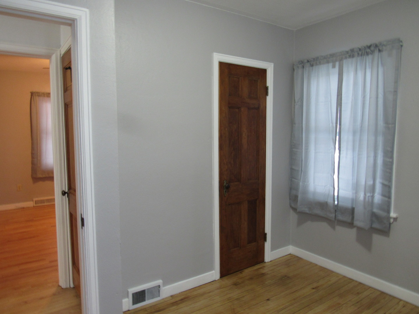 730 Lincoln Road Bettendorf, IA 52722 - Photo 9 of 13 an empty room with wooden floor and entrance