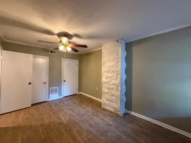 a large kitchen with a stove a refrigerator and a sink