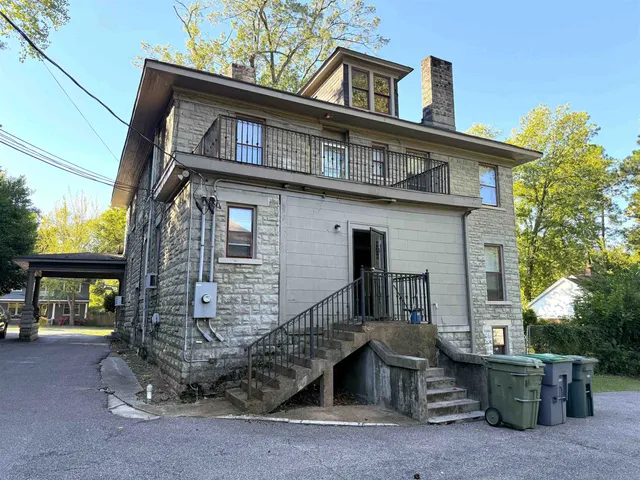 an aerial view of multiple houses with yard