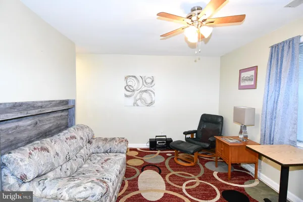 a bedroom with bed and a window