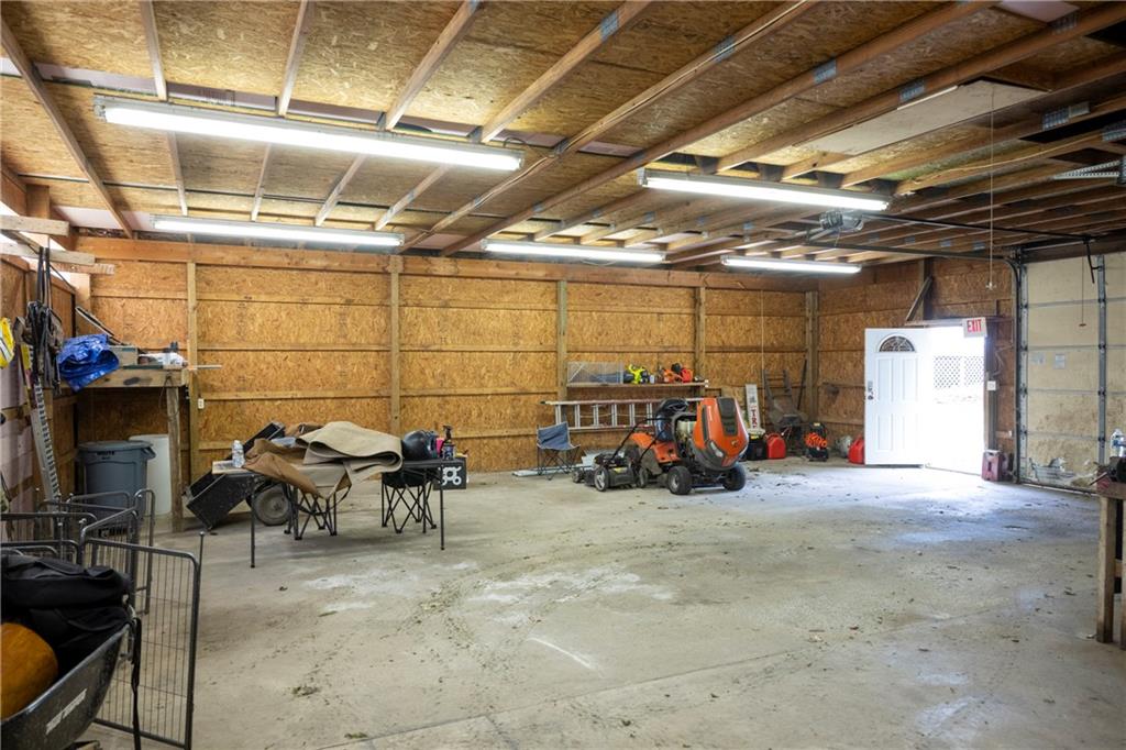 9133 South Watson Run Road Meadville, PA 16335 - Photo 33 of 45 a view of a garage with a table and chairs