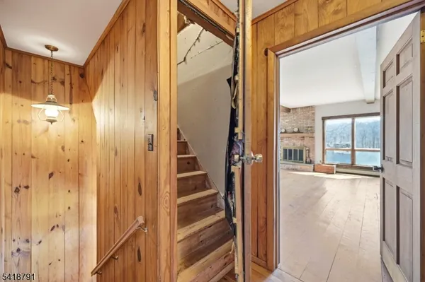 a view of a bathroom with a tub and shower