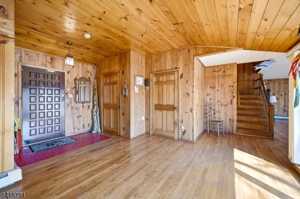 a view of a room with wooden floor