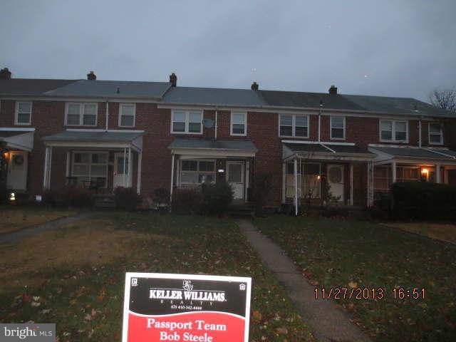 6205 Marlora Road Baltimore, MD 21239 - Photo 1 of 1 a front view of a house with a yard