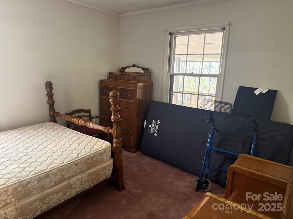 82 Merry Cove Road Sylva, NC 28779 - Photo 16 of 17 a bedroom with a bed and a window