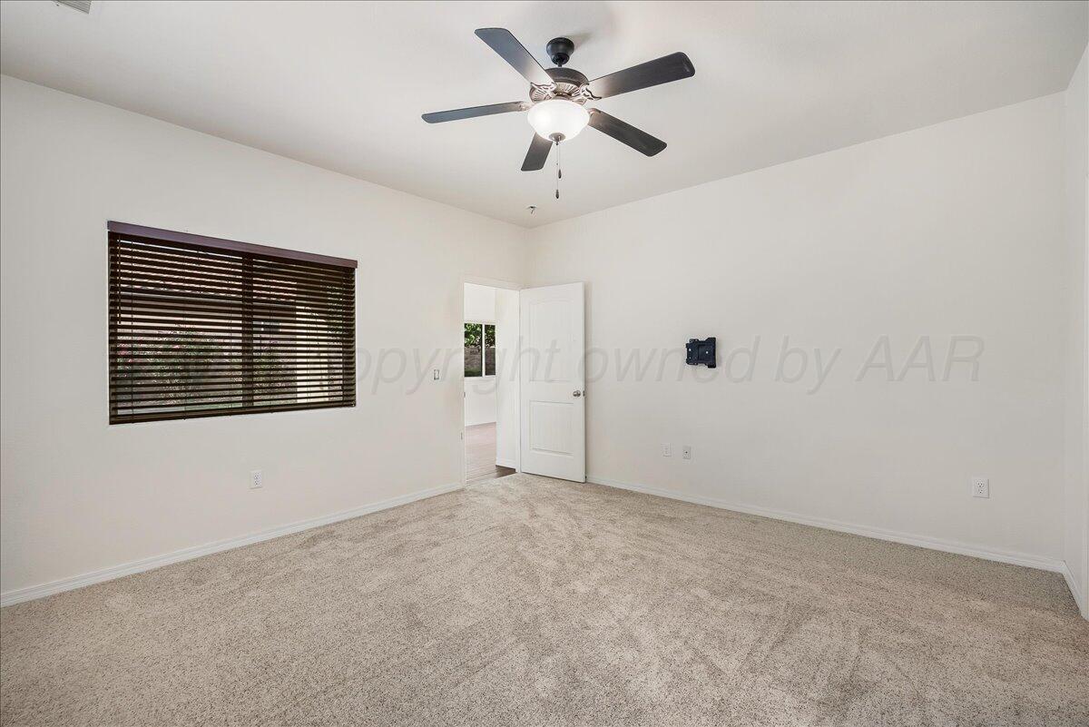 1007 Shiraz Boulevard Amarillo, TX 79124 - Photo 11 of 21 a view of an empty room with a window