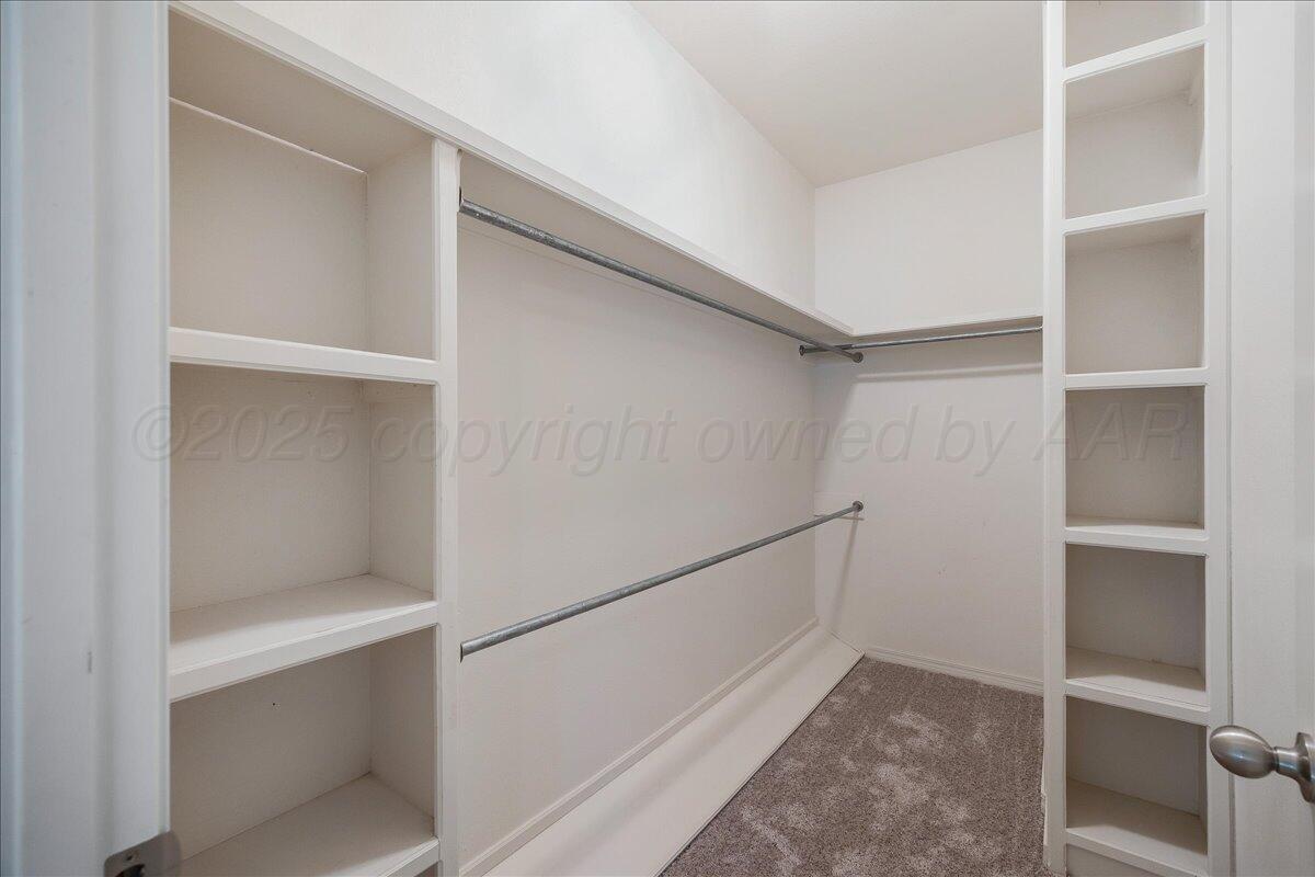 1007 Shiraz Boulevard Amarillo, TX 79124 - Photo 14 of 21 a view of an empty walk in closet