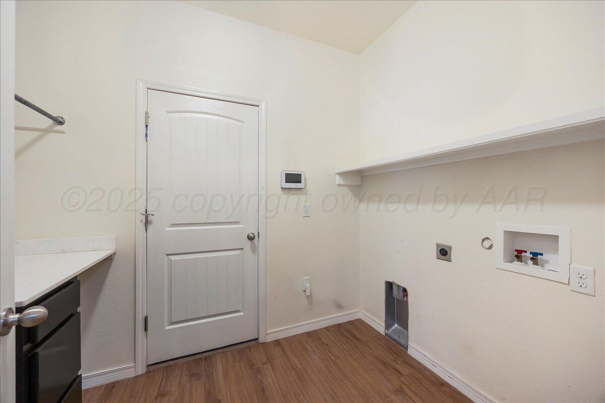 1007 Shiraz Boulevard Amarillo, TX 79124 - Photo 18 of 21 a view of a hallway with wooden floor