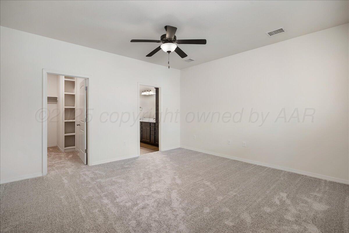 1007 Shiraz Boulevard Amarillo, TX 79124 - Photo 10 of 21 an empty room with closet and windows