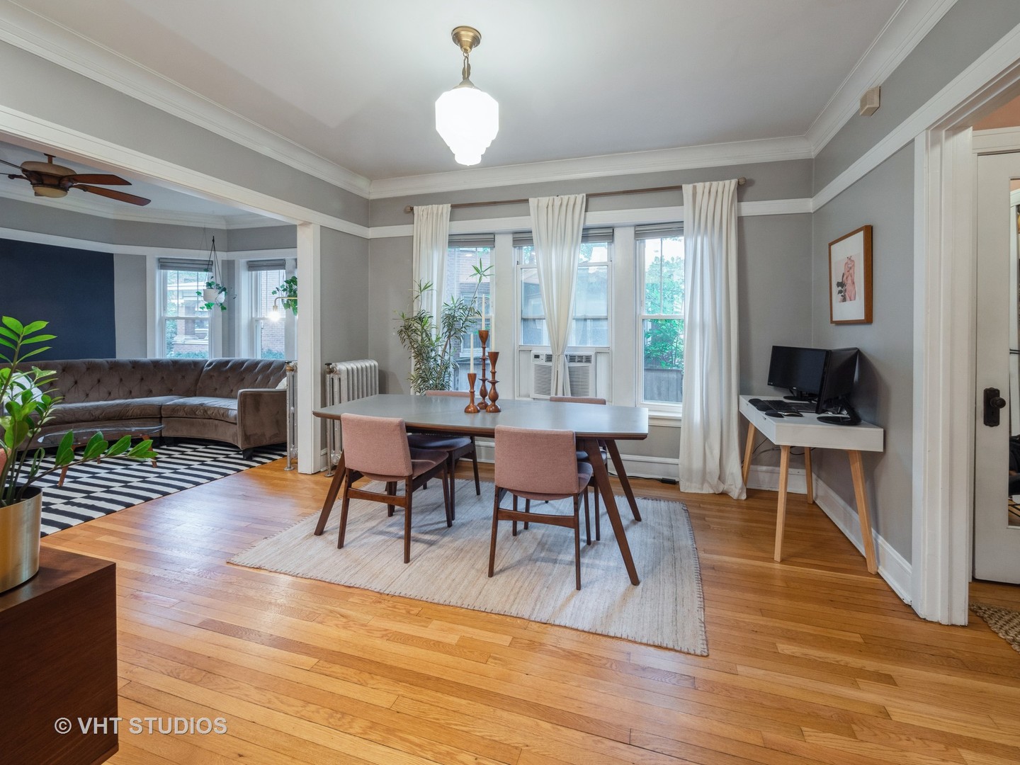 1440 West Summerdale Avenue, Unit 1 Chicago, IL 60640 - Photo 4 of 13 a view of a dining room with furniture window and wooden floor