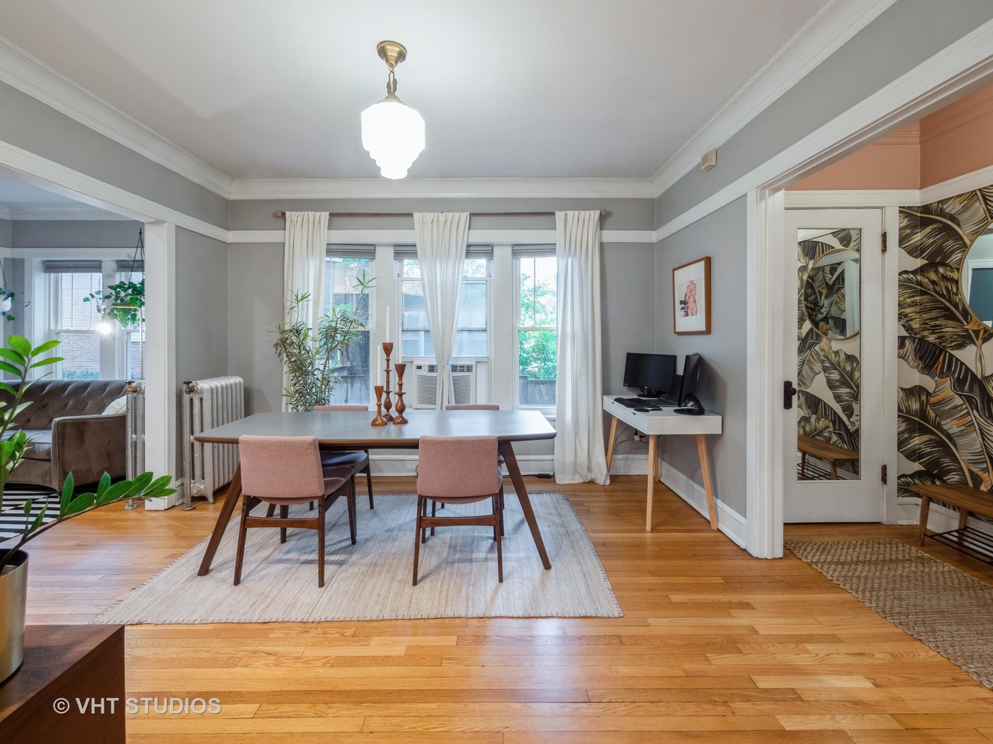 1440 West Summerdale Avenue, Unit 1 Chicago, IL 60640 - Photo 5 of 13 a view of a dining room with furniture window and wooden floor