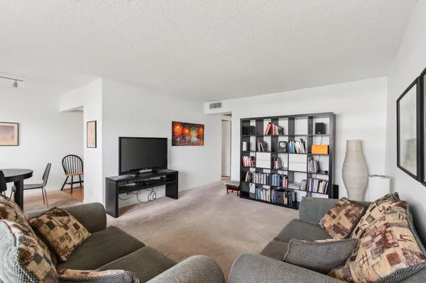 a view of a livingroom with furniture and window