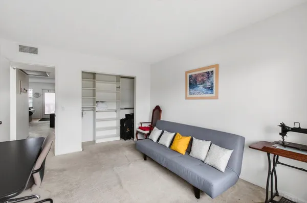 a workspace with furniture and a window