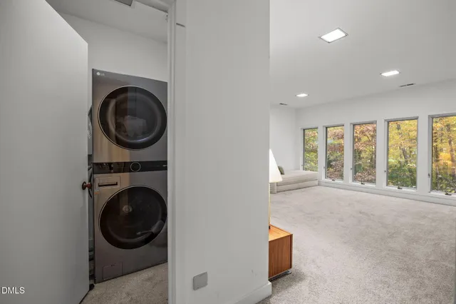 a view of a hallway with washer and dryer