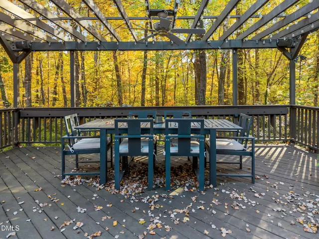 a view of a balcony with lake view and wooden floor