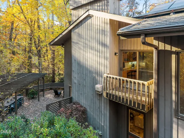 a view of a house with a tree