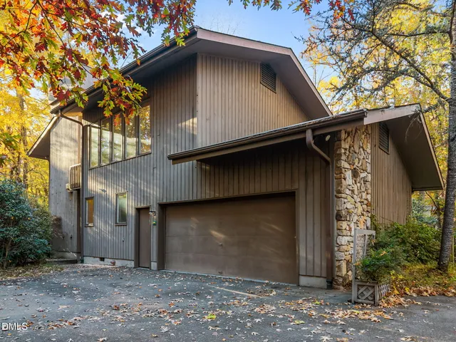 a house with a tree in front of it