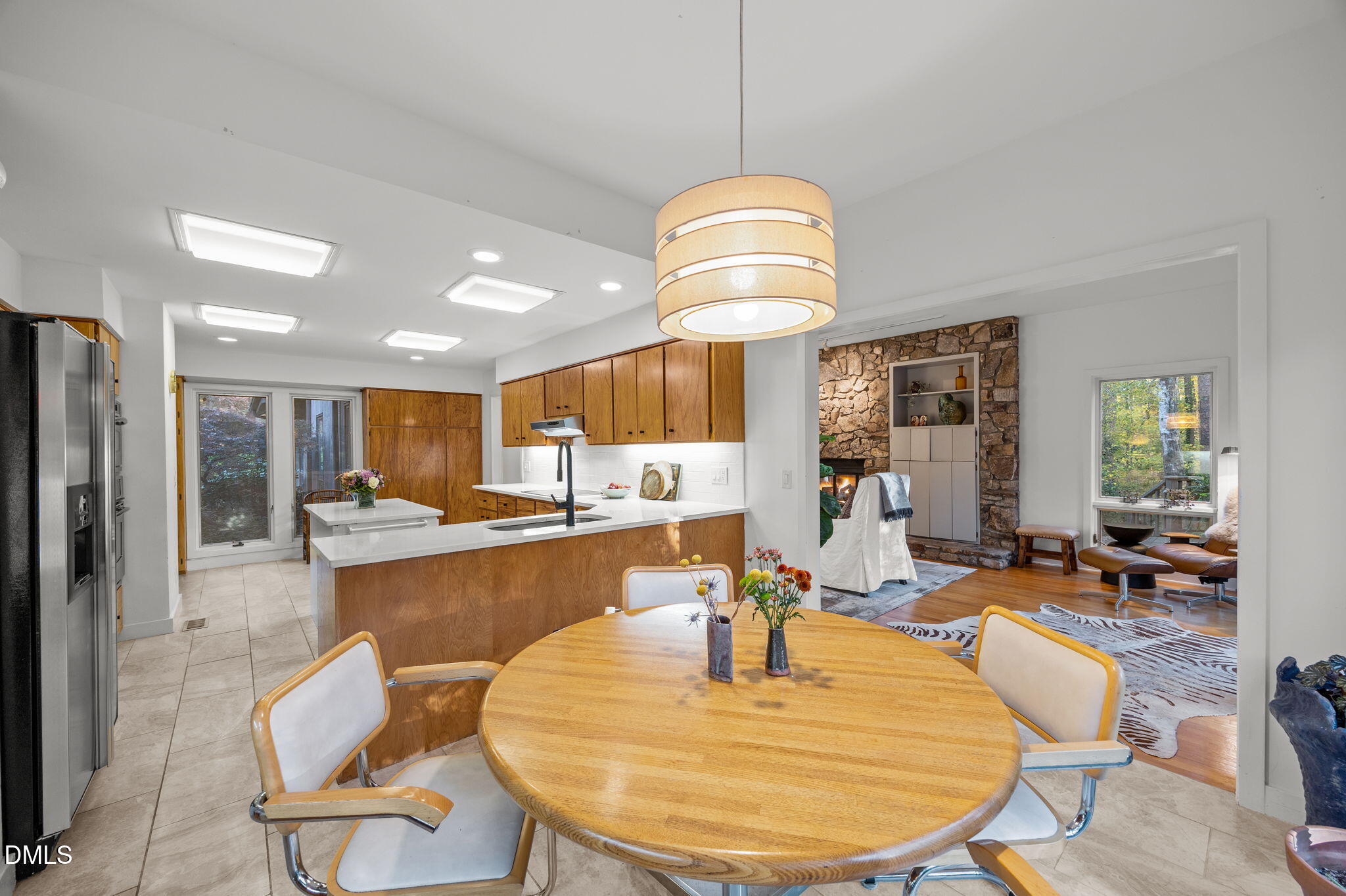 8 Womble Circle Durham, NC 27705 - Photo 8 of 49 an open kitchen with dining table and chairs
