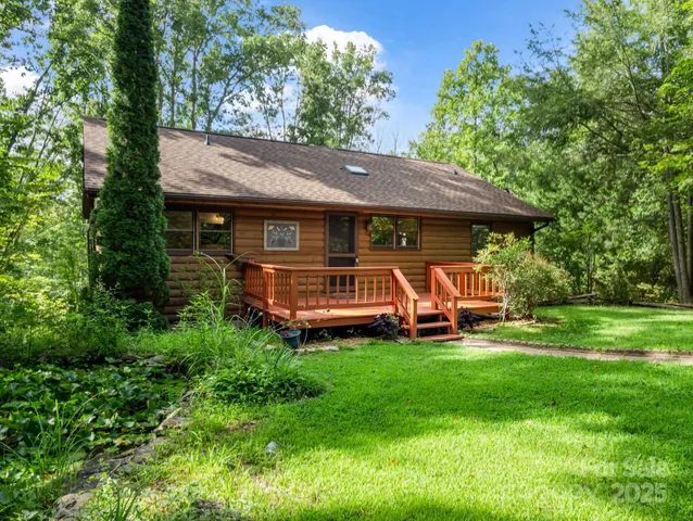 a view of a patio with table and chairs under an umbrella