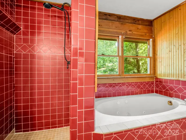 a bath tub sitting next to a window