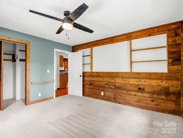 a view of room with window and ceiling fan