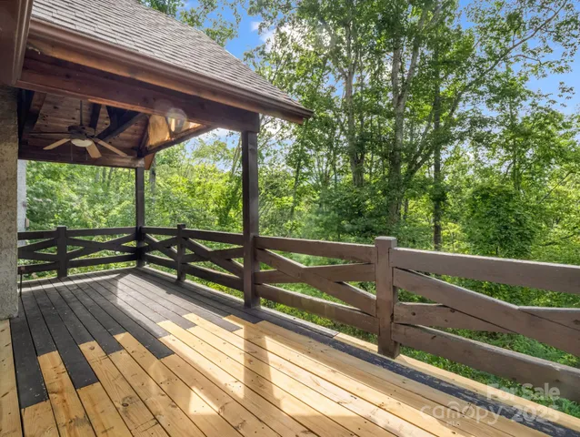 a view of two chairs in the balcony