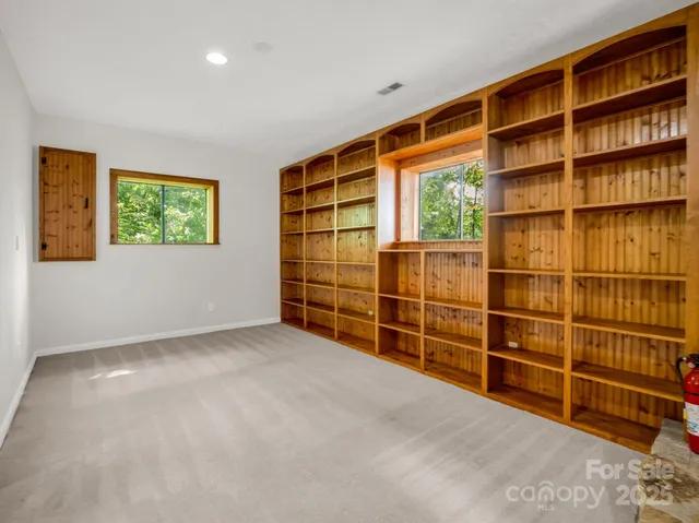 an empty room with shelves