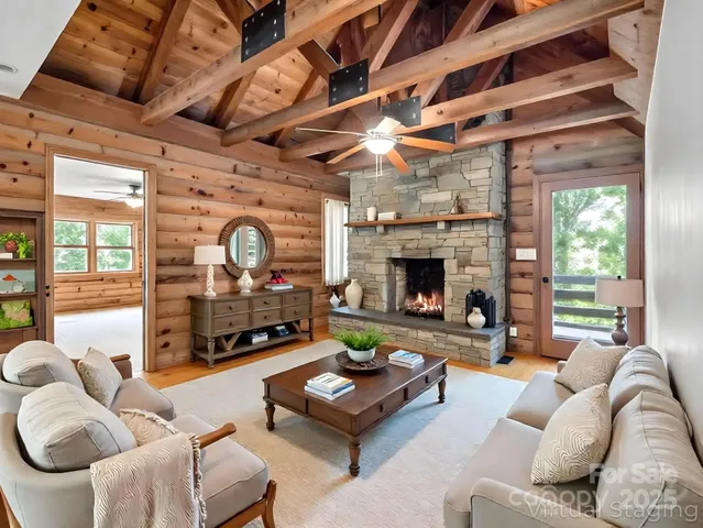 a living room with furniture and a fireplace
