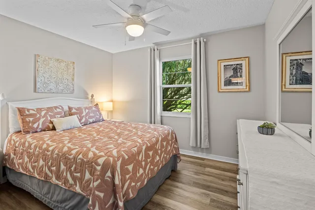 a bedroom with a bed and a lamp