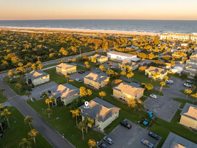 an aerial view of residential houses with outdoor space