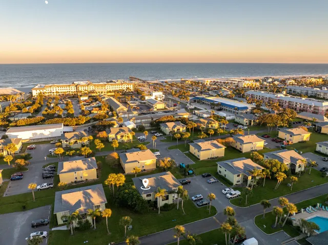 an aerial view of residential building with parking space