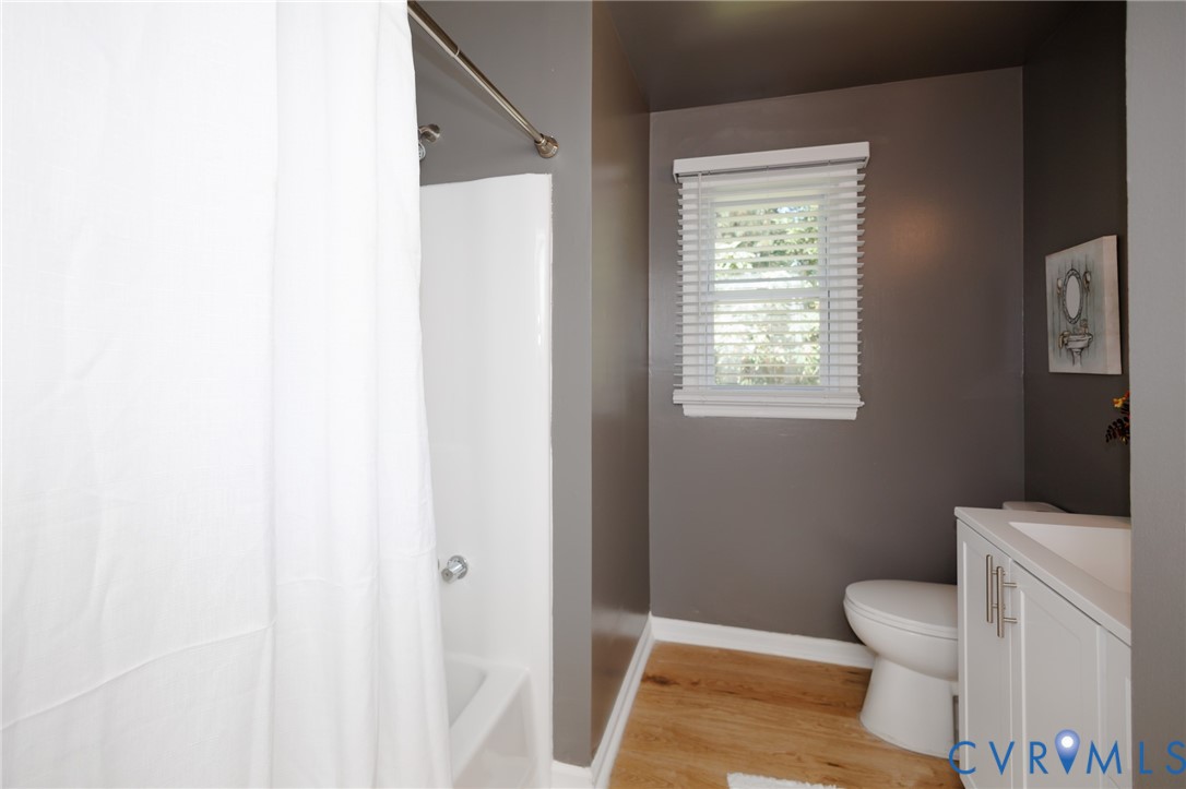 20520 Cox Road Sutherland, VA 23885 - Photo 15 of 31 White bathtub with shower, wood-finish flooring, w