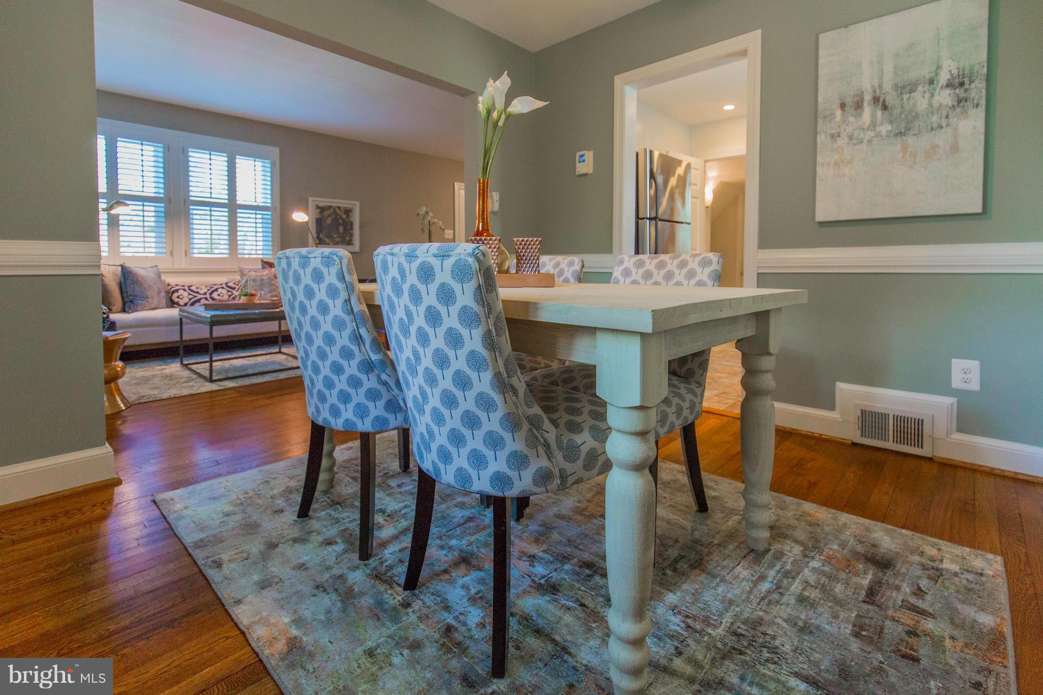 9010 Eton Road Silver Spring, MD 20901 - Photo 11 of 30 a view of a dining room with furniture and wooden floor