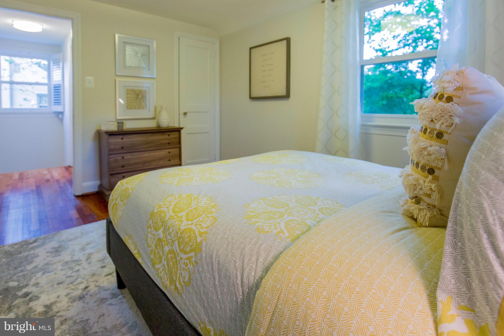 9010 Eton Road Silver Spring, MD 20901 - Photo 19 of 30 a bedroom with a bed and a dresser