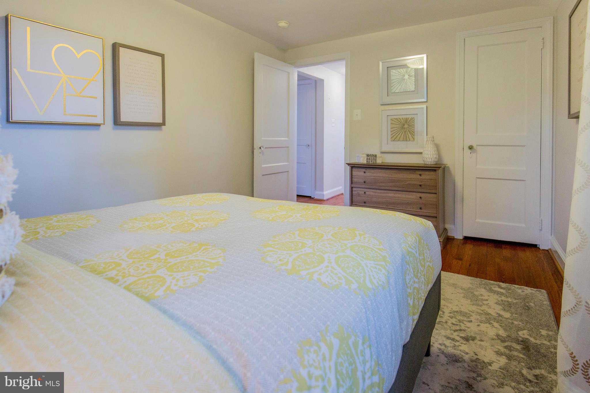 9010 Eton Road Silver Spring, MD 20901 - Photo 20 of 30 a bed sitting in a bedroom next to a window