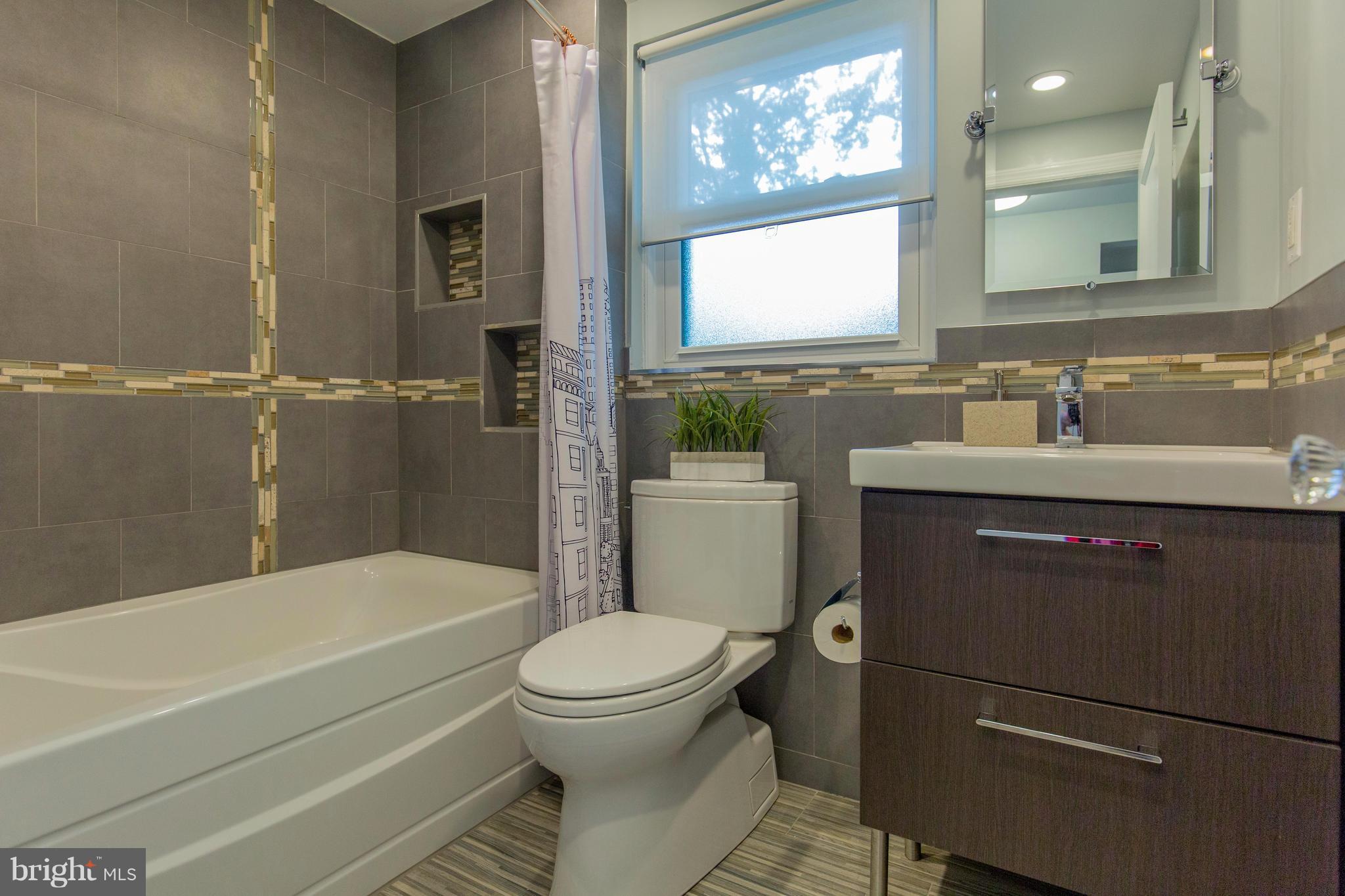 9010 Eton Road Silver Spring, MD 20901 - Photo 23 of 30 a bathroom with a sink toilet and shower