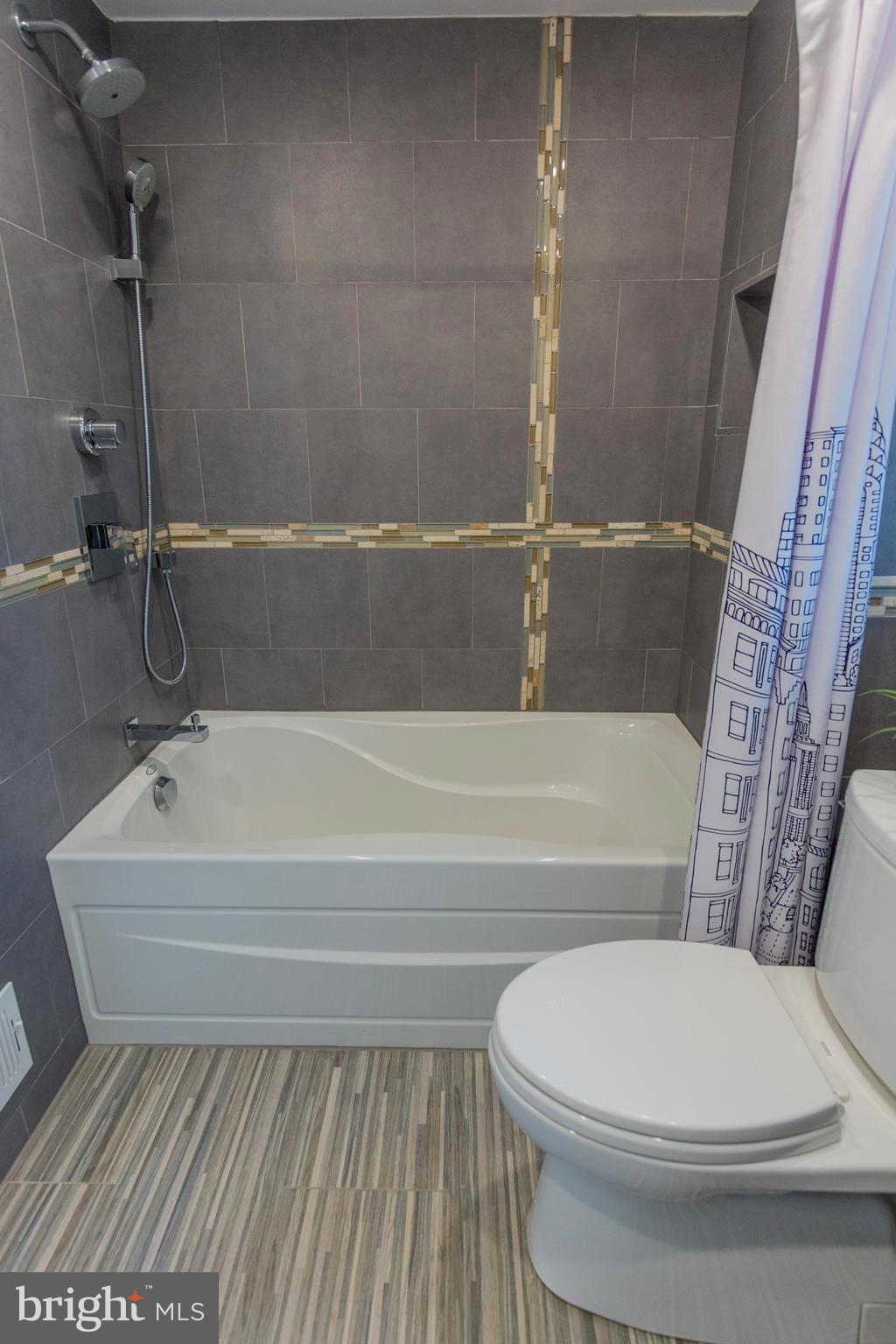 9010 Eton Road Silver Spring, MD 20901 - Photo 24 of 30 a bathroom with a toilet and a bathtub