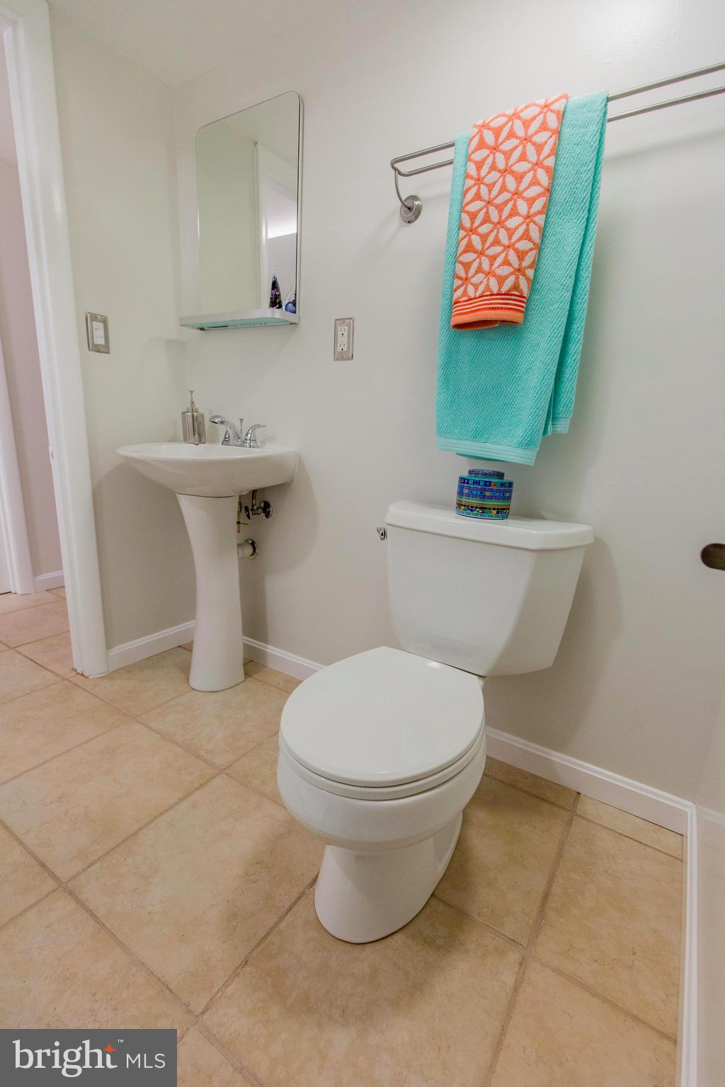 9010 Eton Road Silver Spring, MD 20901 - Photo 30 of 30 a bathroom with a toilet sink and mirror