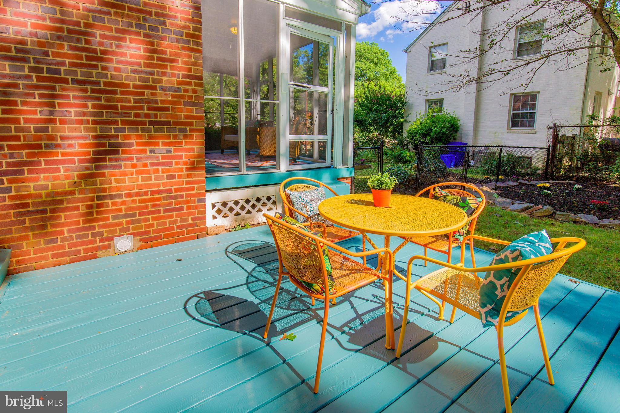 9010 Eton Road Silver Spring, MD 20901 - Photo 4 of 30 a backyard of a house with barbeque oven table and chairs
