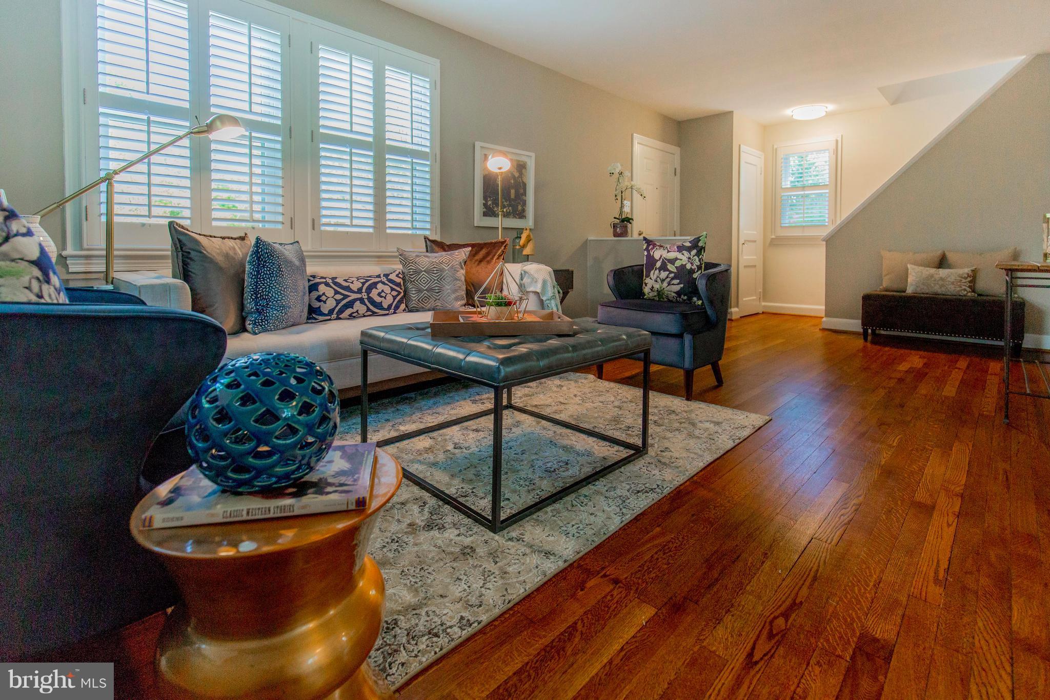 9010 Eton Road Silver Spring, MD 20901 - Photo 7 of 30 a living room with furniture and a wooden floor