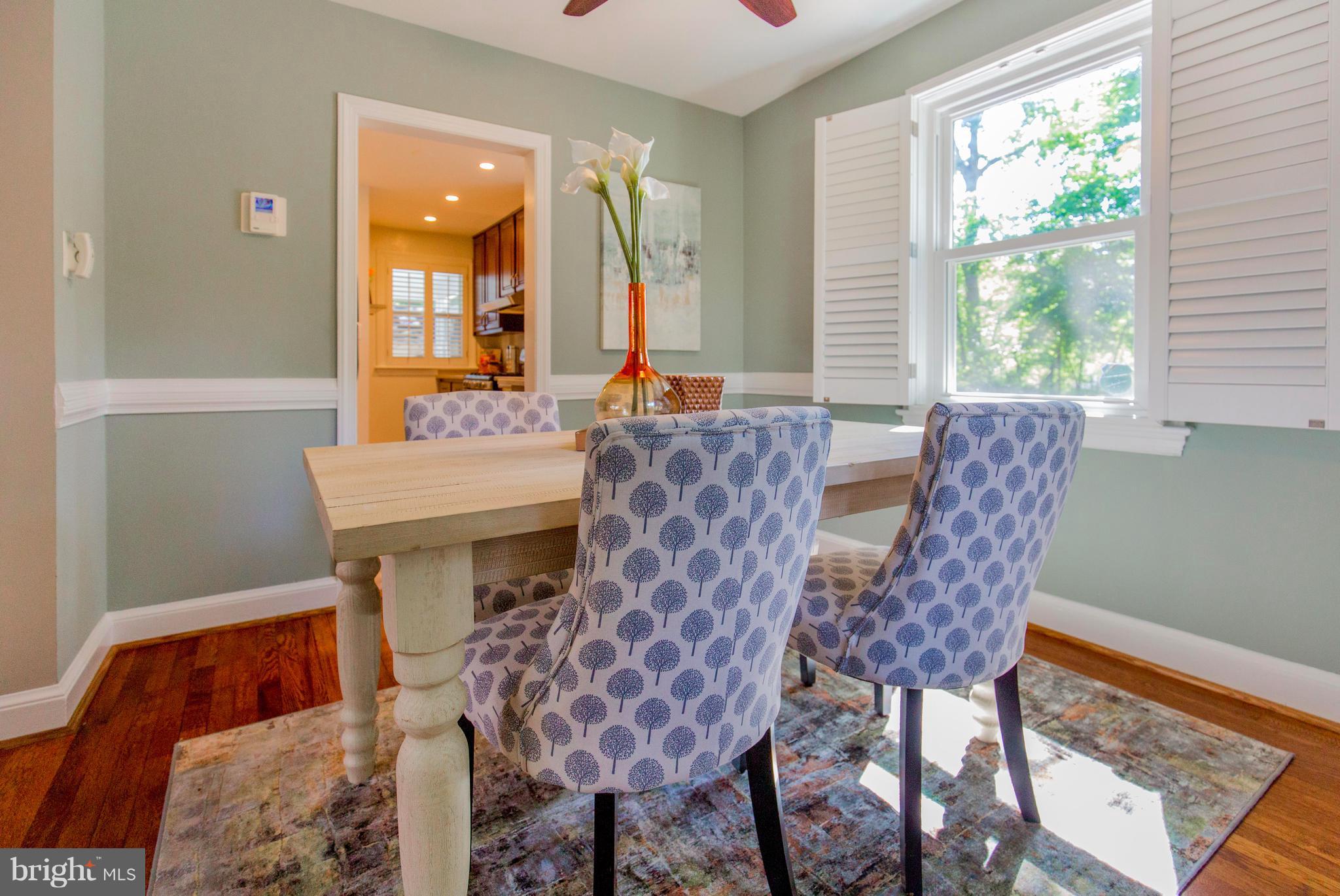 9010 Eton Road Silver Spring, MD 20901 - Photo 9 of 30 a view of a dining room with furniture and a window