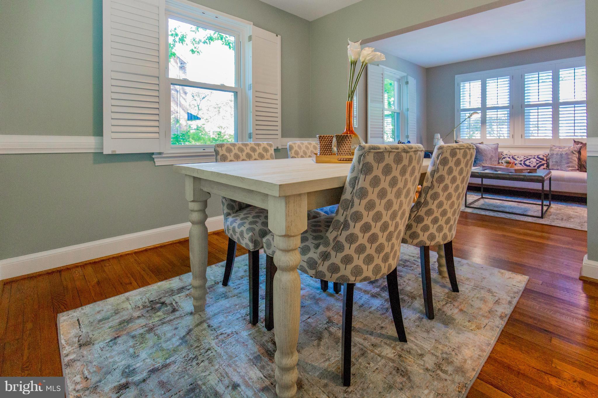 9010 Eton Road Silver Spring, MD 20901 - Photo 10 of 30 a view of a dining room with furniture window and wooden floor