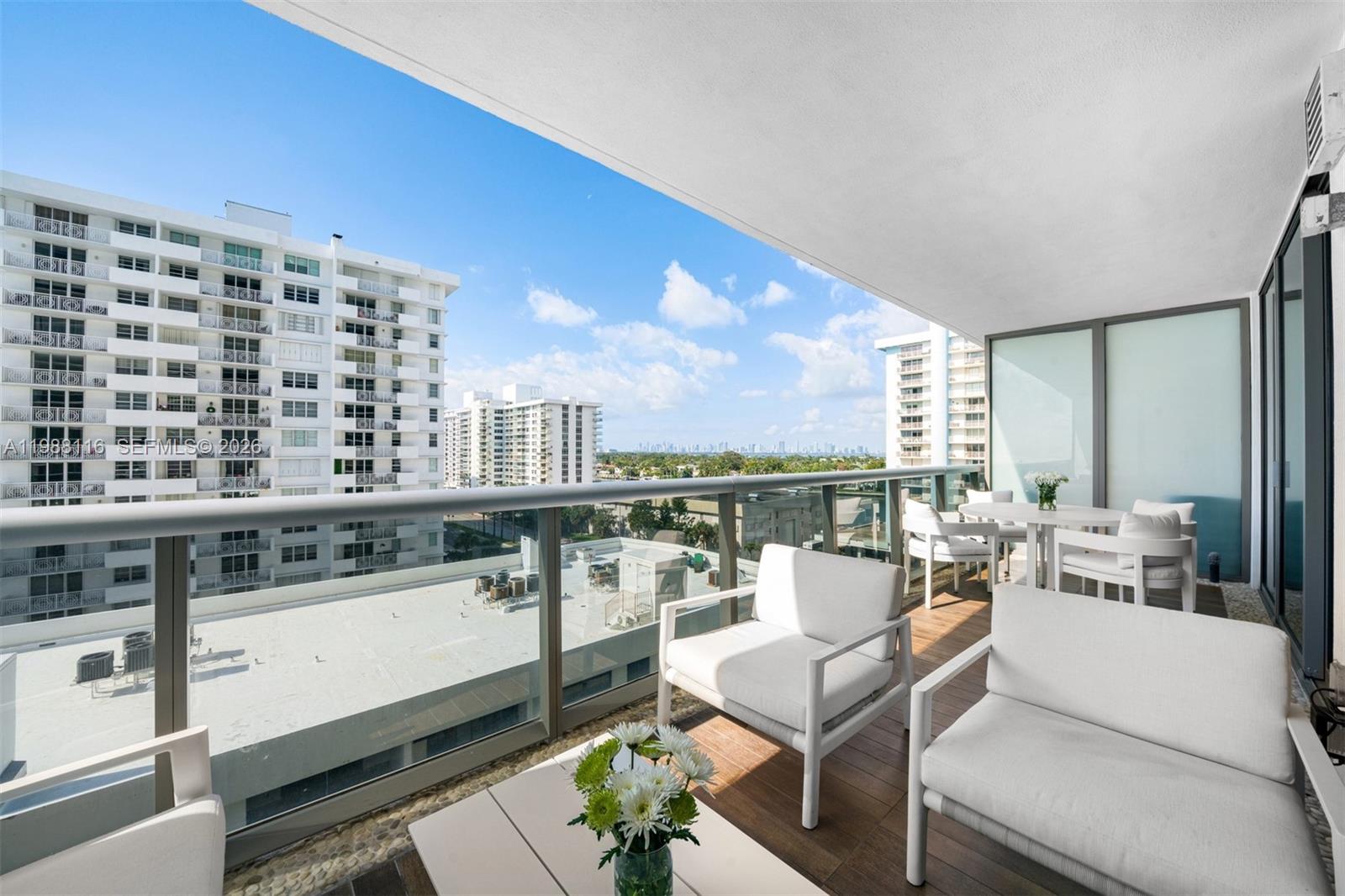 5875 Collins Avenue, Unit 906 Miami Beach, FL 33140 - Photo 12 of 20 a view of a living room and kitchen area