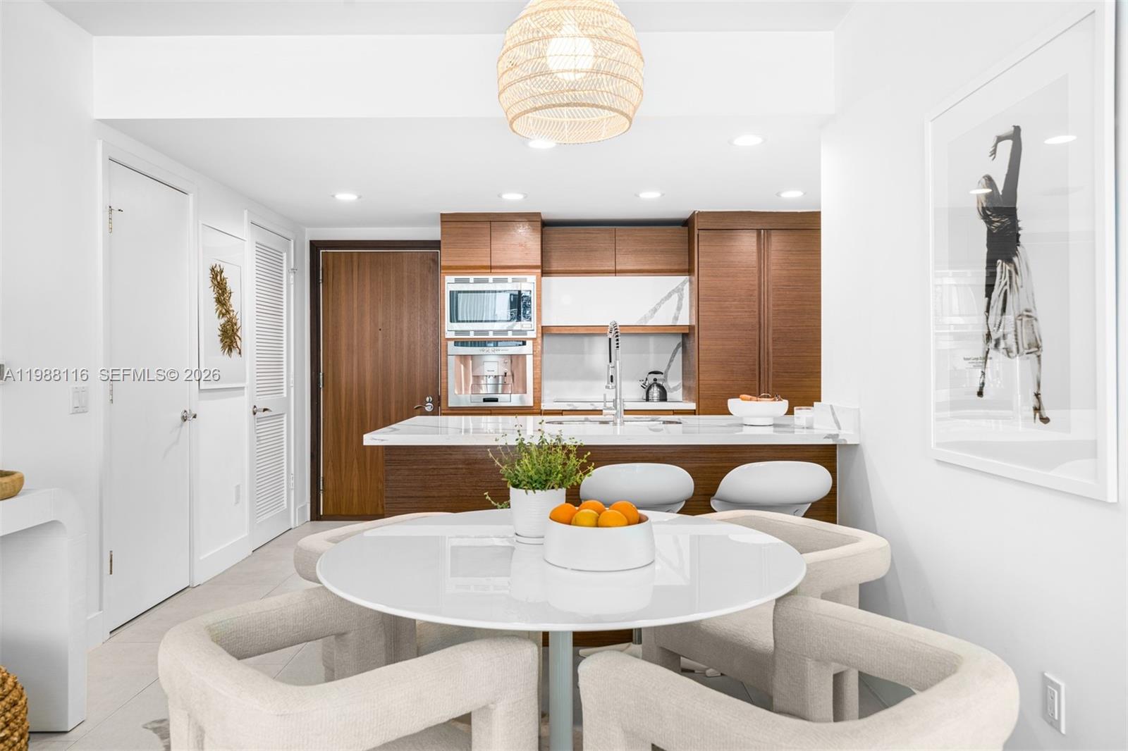 5875 Collins Avenue, Unit 906 Miami Beach, FL 33140 - Photo 3 of 20 a dining room with furniture and window