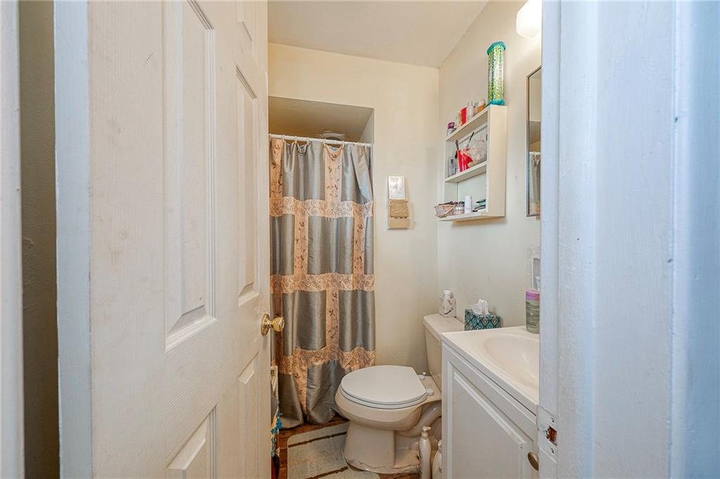 923 Locust Street Coraopolis, PA 15108 - Photo 11 of 27 a bathroom with a sink toilet and shower
